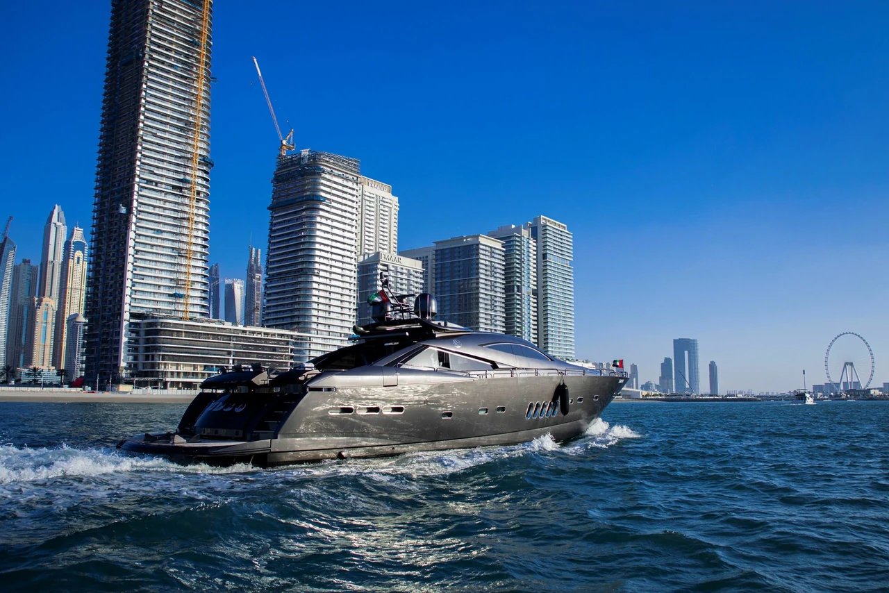 Black Predator 95 cruising beside Dubai’s waterfront towers