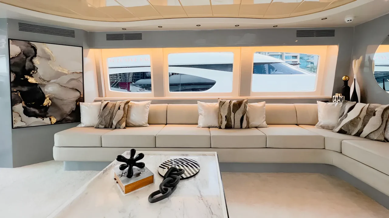 Interior lounge with long sofa aboard Xclusive 16