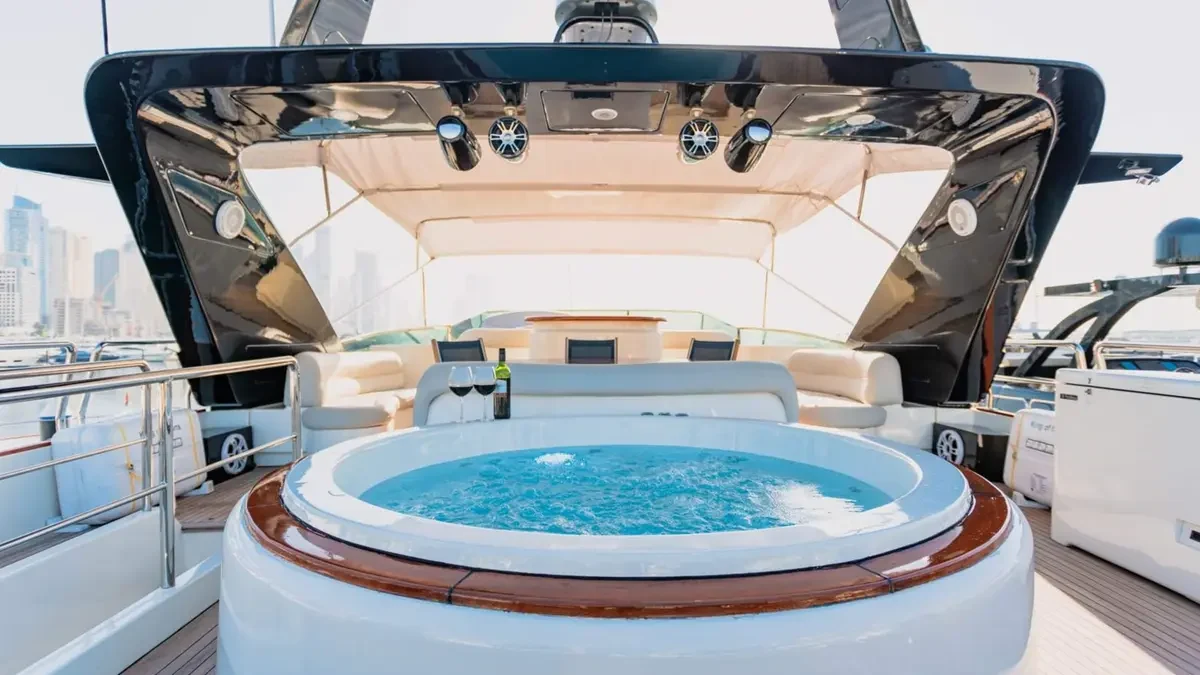 Circular jacuzzi and curved seating on Azimut 100’s upper deck
