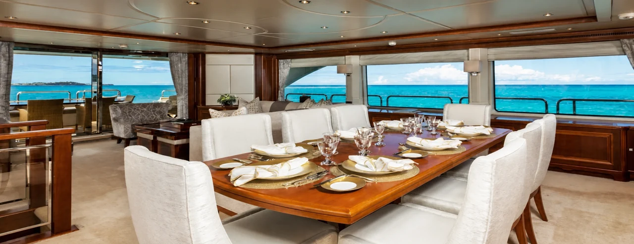 Indoor dining saloon aboard 110Ft Benetti Yacht