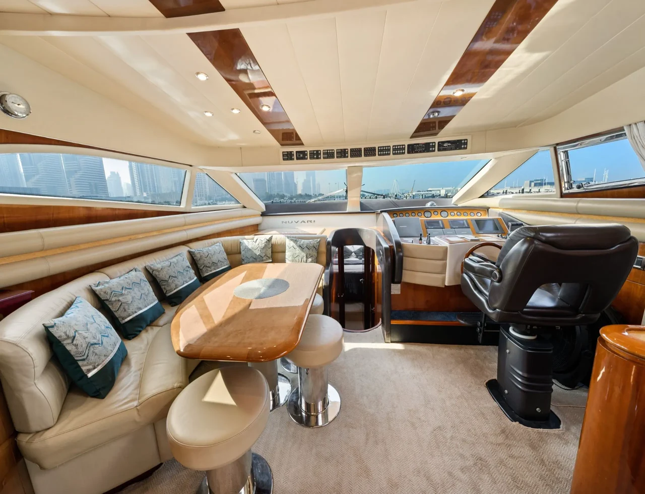 Wood-finished lounge with curved seating aboard Luna 68