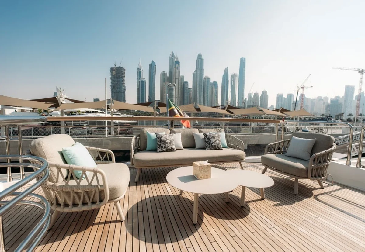 Outdoor lounge seating aboard Aarna at the Dubai waterfront