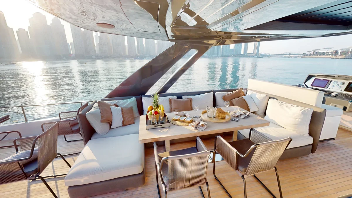 Outdoor dining table and seating aboard Bella III