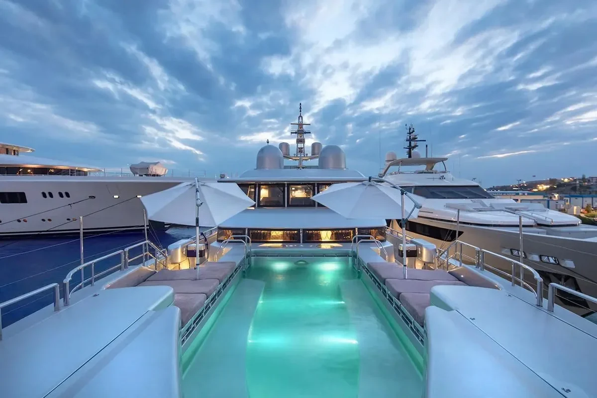 Illuminated foredeck pool aboard Thunder at dusk