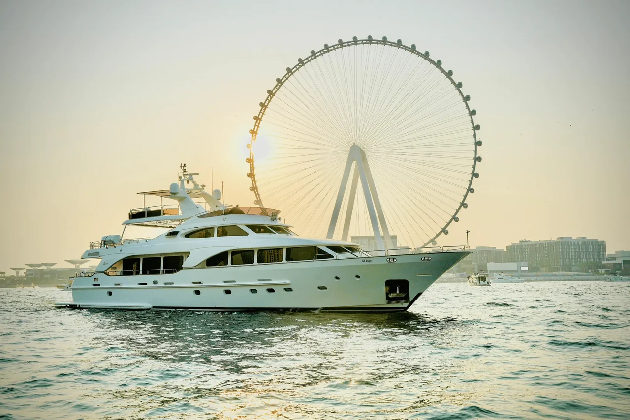 Benetti 120 alongside Ain Dubai in evening light