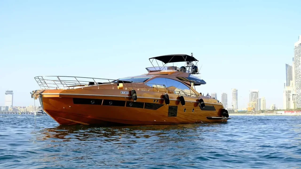 Bronze Azimut 77 cruising beside the Dubai skyline
