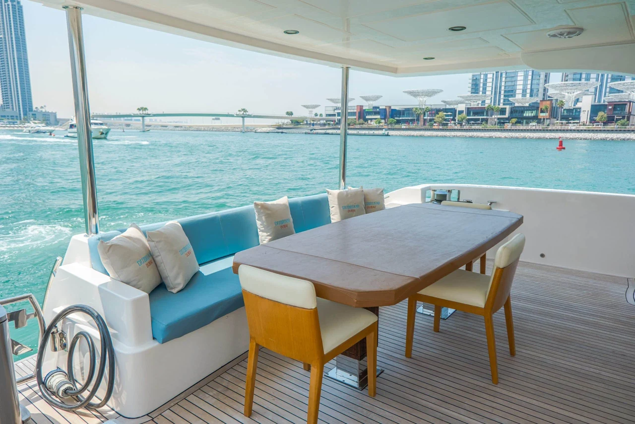 Cabo 77’s sheltered outdoor dining table overlooking the water