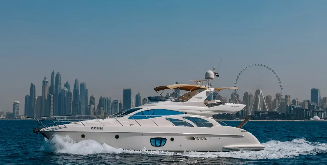 Elite White Pearl cruising with the Dubai skyline behind