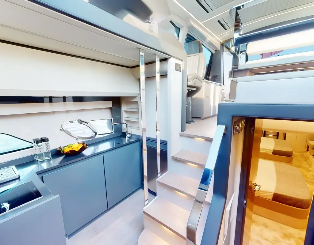 Companionway and compact galley aboard Elite Pershing White