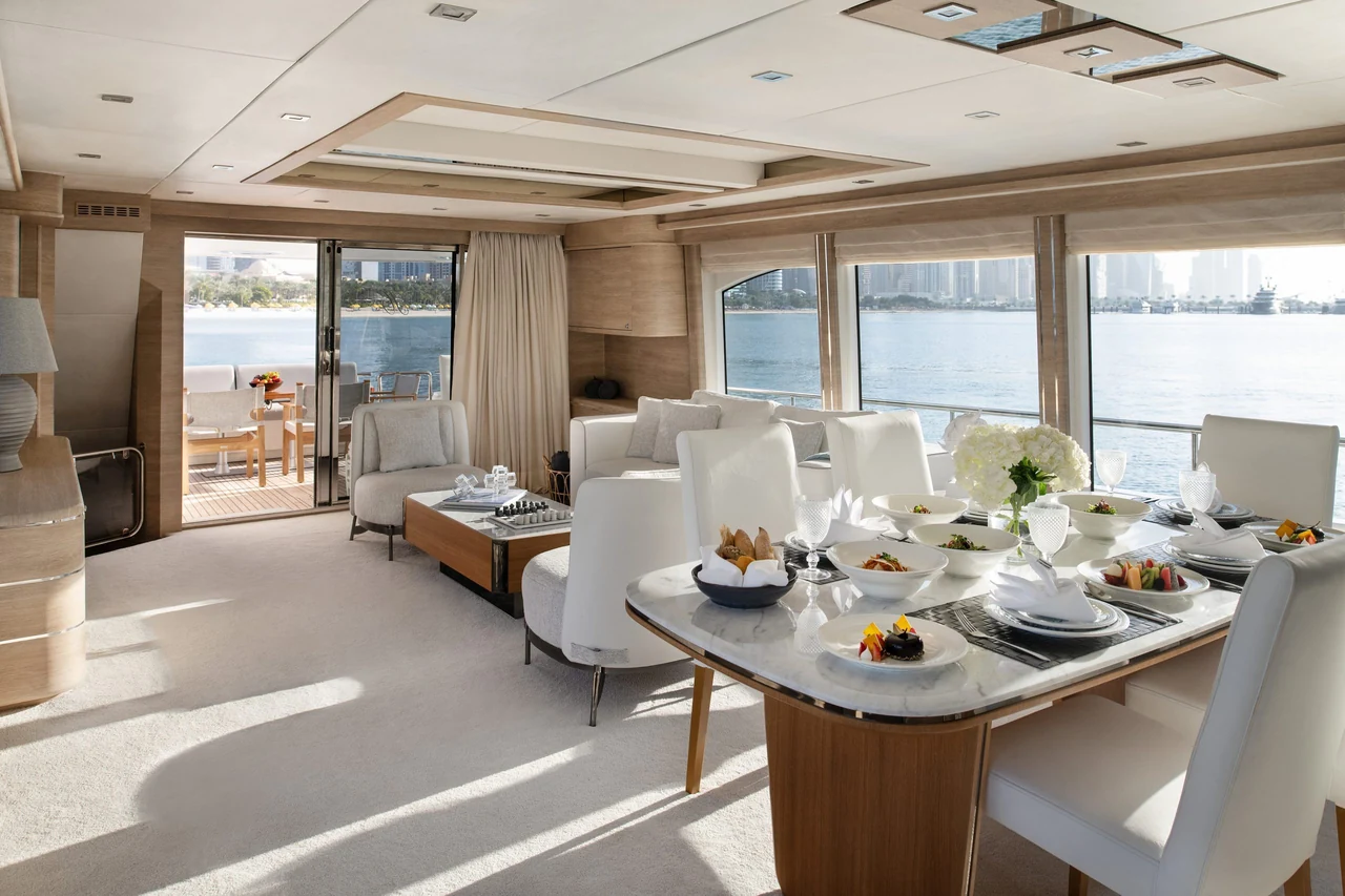 Indoor dining table and bright saloon aboard Haigan 96