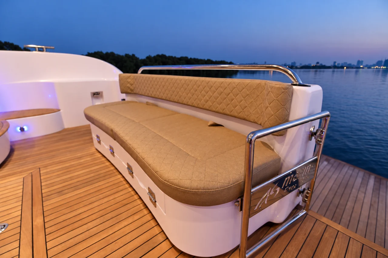 Quilted aft-deck seating aboard Novia 55 at dusk