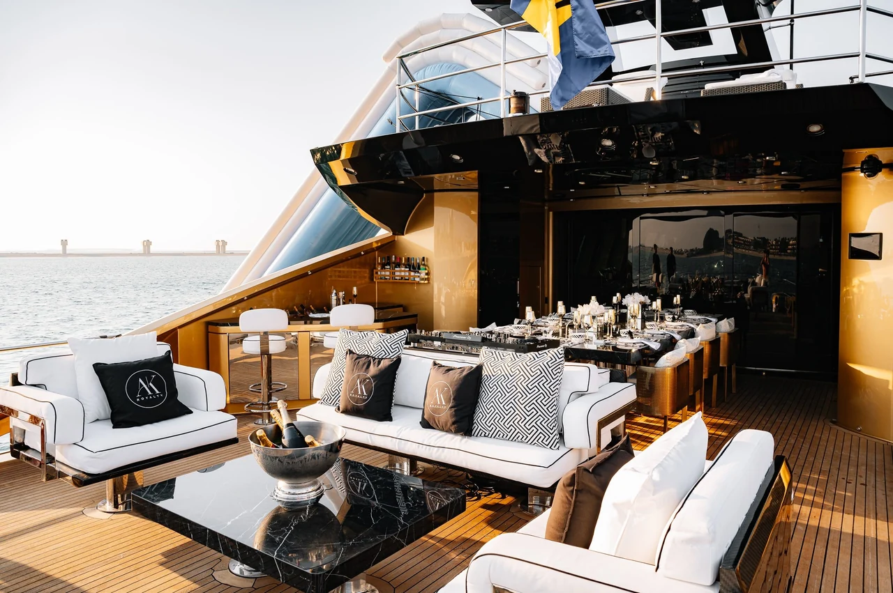 Aft lounge, bar and dining setting aboard Royalty 136