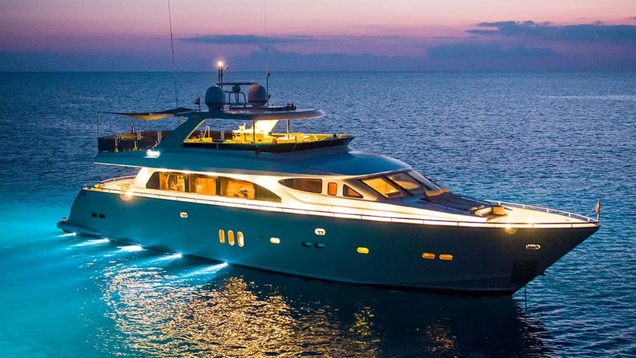 Zeta 100 illuminated on calm water at dusk