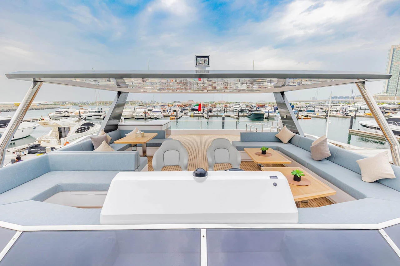 Wide flybridge lounge and tables aboard Zirve 72