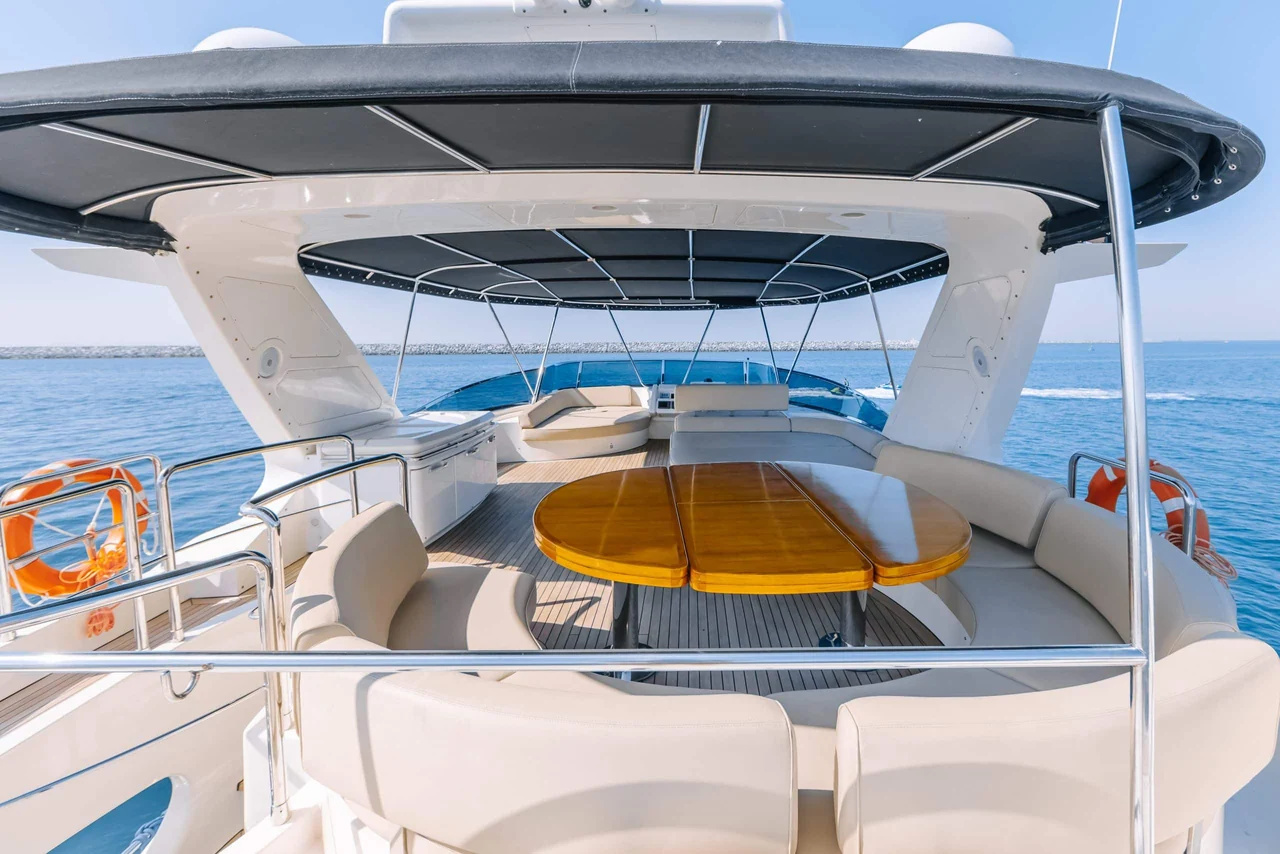 Covered upper dining table and seating on Azimut 79