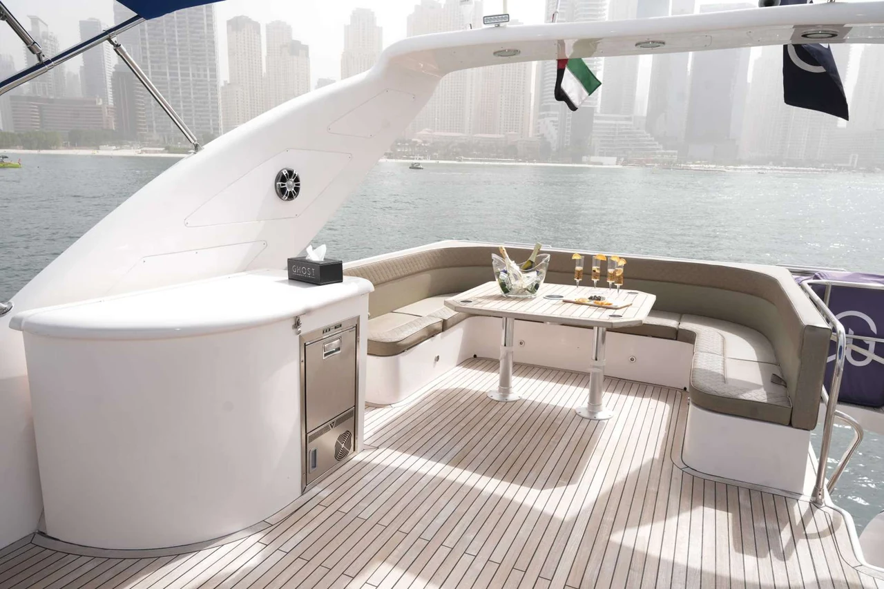 Pale aft lounge and table aboard Belle 75