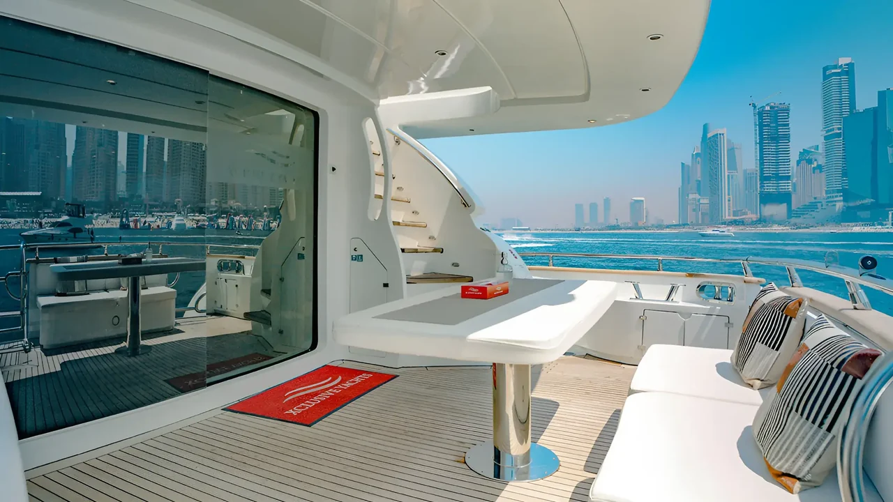 Covered aft deck and dining table on Xclusive 12