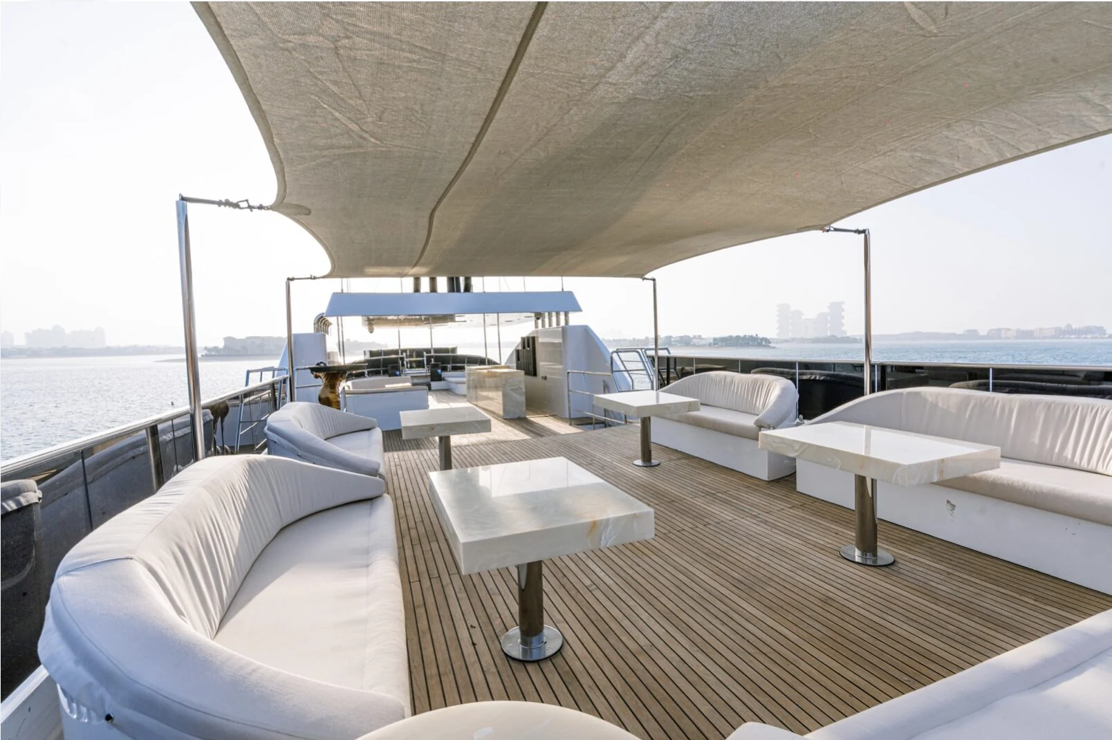 Finesse yacht outdoor lounge illuminated at sunset
