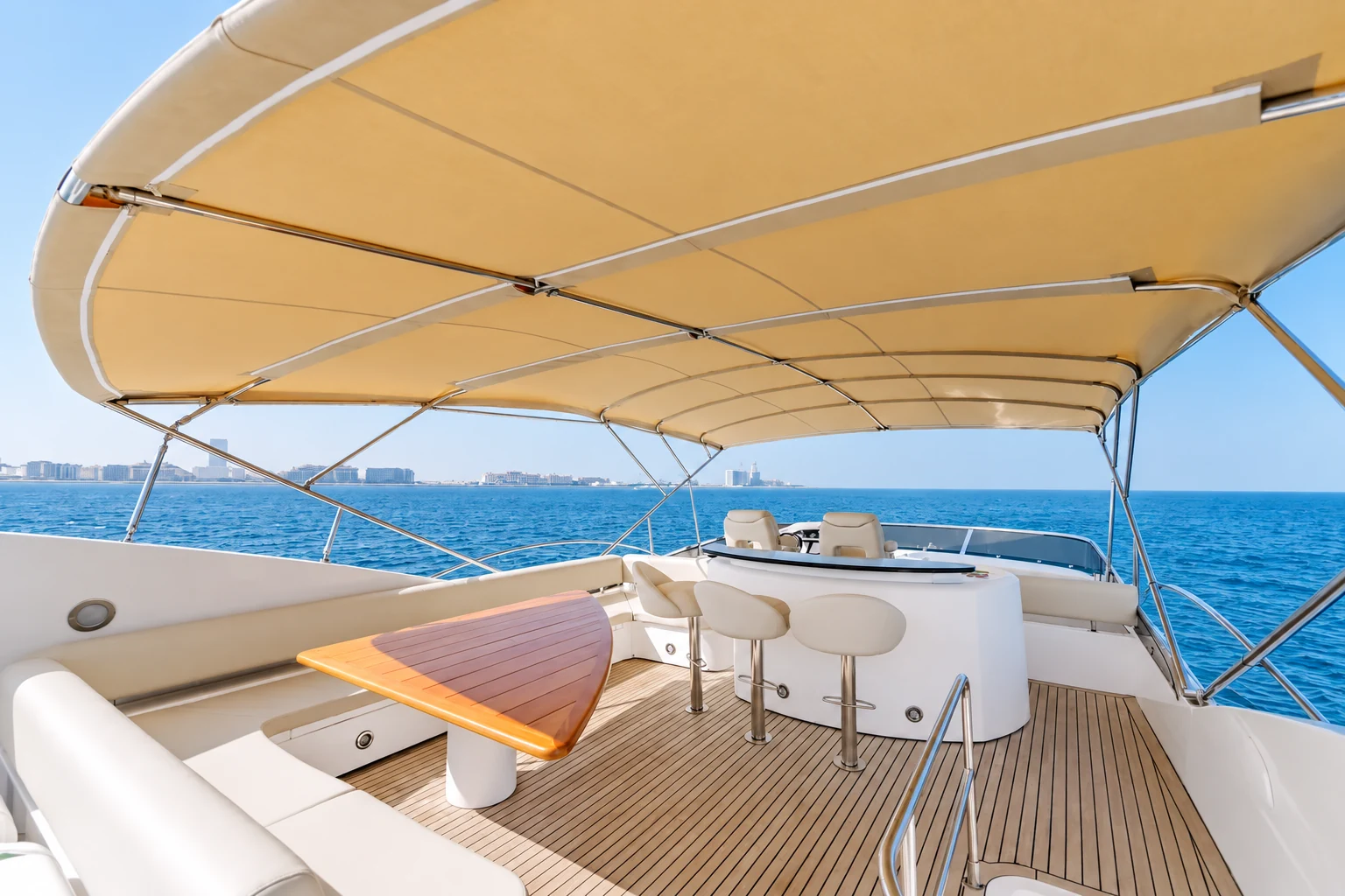 Sunseeker 88 yacht flybridge dining area with sea view